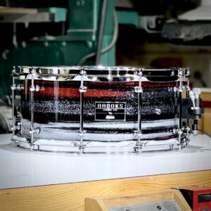Steam-bent solid maple snare drum custom hand painted for St. Jude Children's Hospital colors with a high-gloss polyester clear coat and triple-flanged hoops